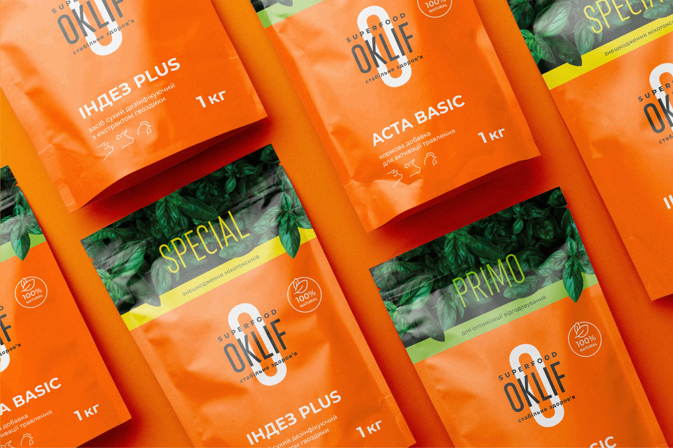 Oklif orange product pouches with green leaf windows arranged in rows