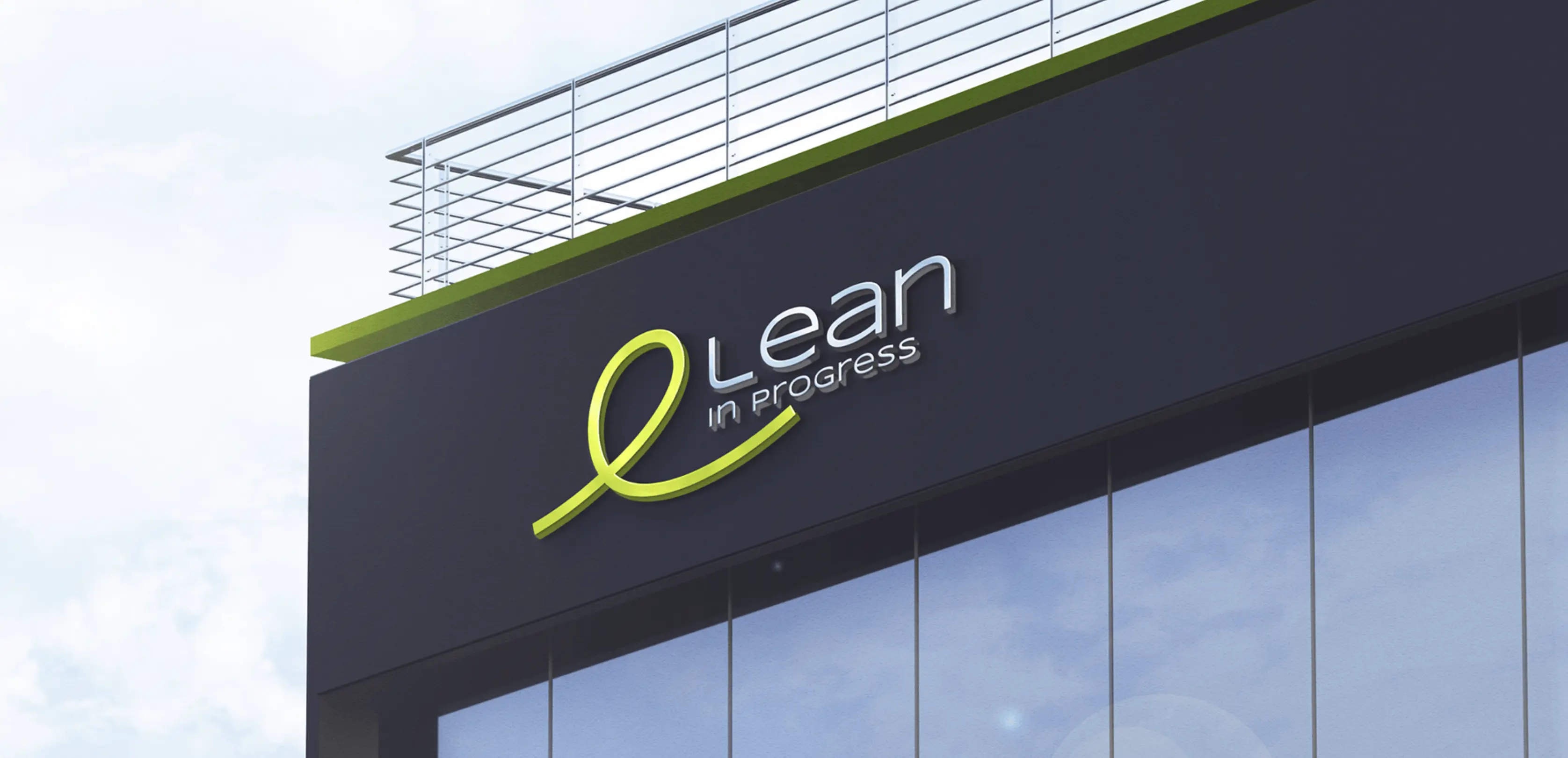 Lean in Progress logo on a dark office building facade